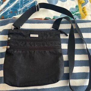 Travel safe with the Baggallini Black Crossbody Bag with Adjustable Strap